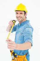 Happy male architect holding tape measure