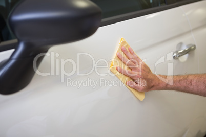 Close up of man cleaning his car