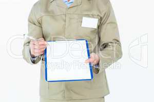 Delivery man showing blank paper on clipboard