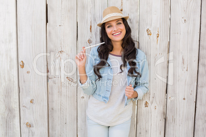 Pretty brunette thinking and smiling