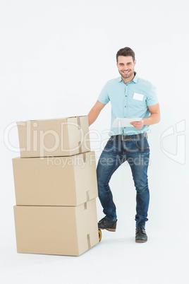 Delivery man with cardboard boxes