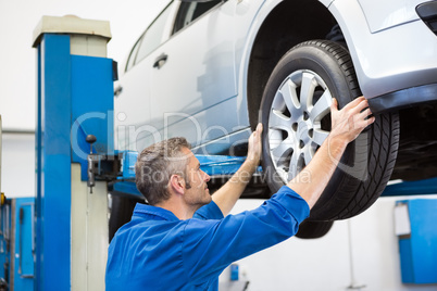 Mechanic adjusting the tire wheel