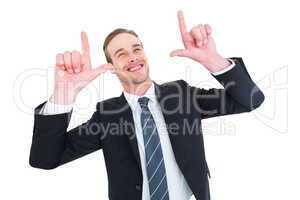 Happy businessman pointing with fingers