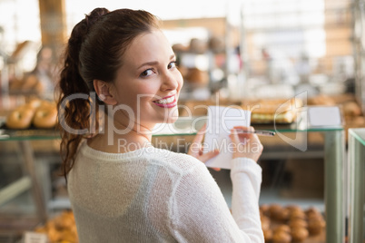 Woman checking her shopping list