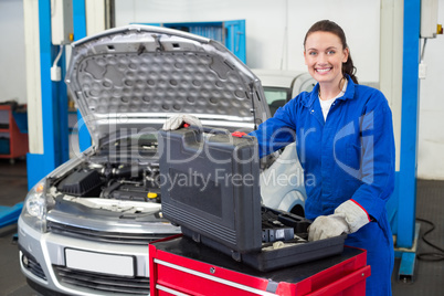 Mechanic smiling at the camera Mechanic smiling at the camera