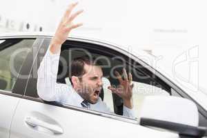 Businessman experiencing road rage