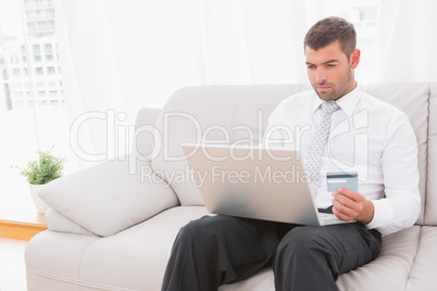 Businessman buying things in internet