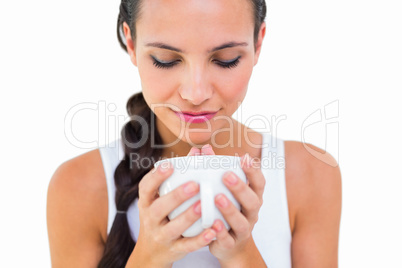 Pretty brunette having cup of tea