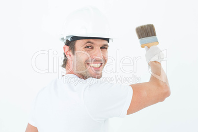 Portrait of happy man using paintbrush