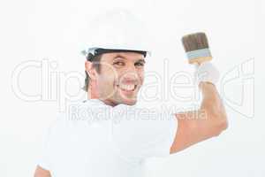 Portrait of happy man using paintbrush