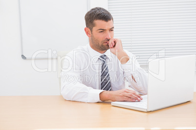 A businessman working at desk