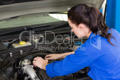 Mechanic working under the hood