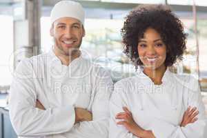 Team of bakers smiling at camera