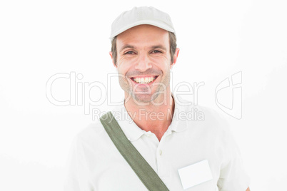 Smiling delivery man wearing cap