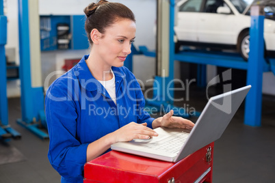 Mechanic working on a laptop