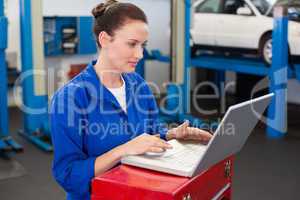 Mechanic working on a laptop