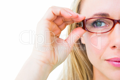 Close up of pretty blonde with red reading glasses