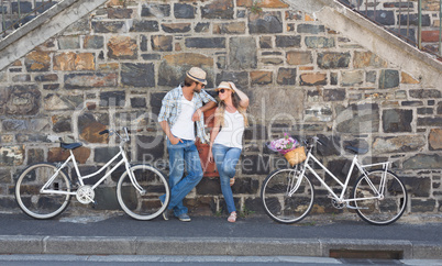 Attractive couple standing with bikes