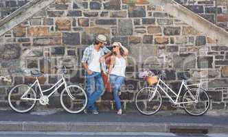 Attractive couple standing with bikes