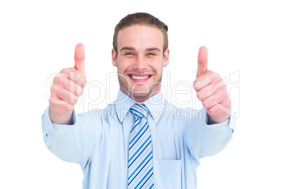 Positive businessman smiling with thumbs up