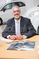 Happy businessman working at his desk