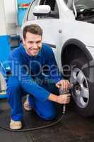 Mechanic adjusting the tire wheel