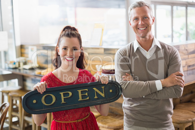 Cafe owners smiling at the camera