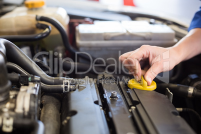 Mechanic working under the hood