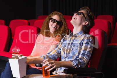 Young couple watching a 3d film