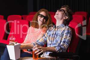 Young couple watching a 3d film