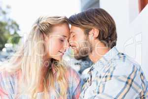 Attractive couple sitting on bench