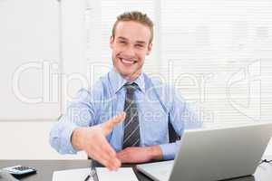 Smiling businessman on an chair office offering handshake