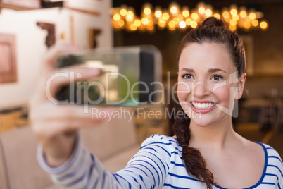 Young woman taking a selfie