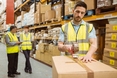 Warehouse workers preparing a shipment