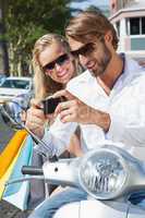 Cute couple riding a scooter