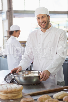 Smiling baker looking at camera