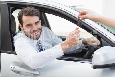 Businessman sitting in drivers seat