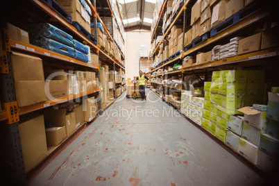 Worker with trolley of boxes