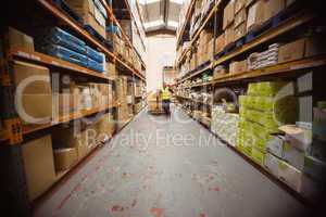 Worker with trolley of boxes