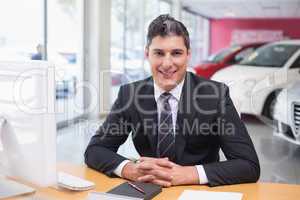 Happy businessman working at his desk