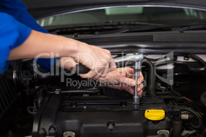 Mechanic working under the hood