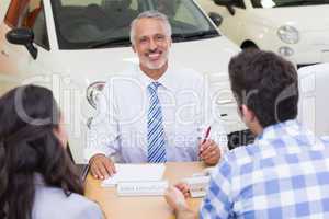 Salesman speaking with his clients