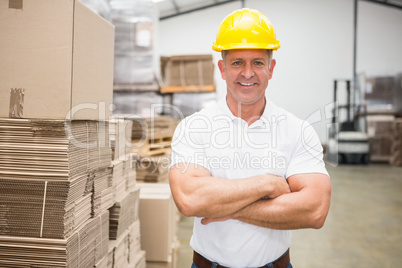 Worker wearing hard hat in warehouse