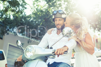 Cute couple with their scooter