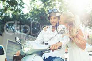 Cute couple with their scooter