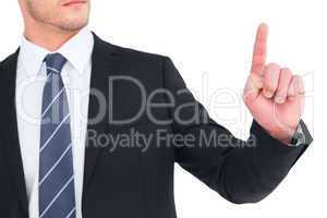 Unsmiling businessman pointing his finger