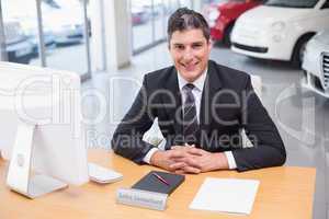 Happy businessman working at his desk