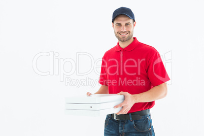 Happy delivery man holding pizza boxes