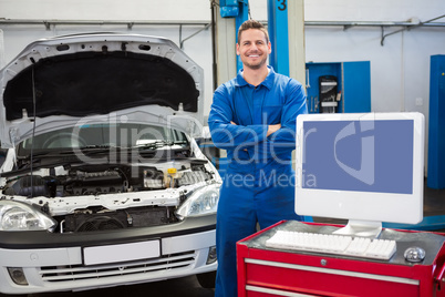 Mechanic smiling at the camera