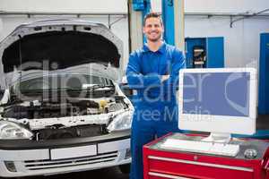 Mechanic smiling at the camera